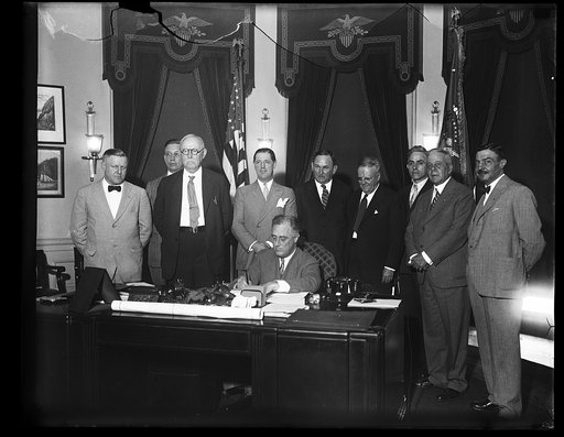 PRESIDENT SIGNS SMALL HOME LOAN MEASURE. PRESIDENT ROOSEVELT TODAY SIGNED THE BILL PROVIDING FOR A $2,000,000,000 REFINANCING OF SMALL HOME MORTGAGES TO PUT THEM ON LOWER INTEREST RATE. THE ADMINISTRATION HOPES TO HAVE THE LAW IN ACTIVE OPERATION WITHIN A MONTH. IN THE PHOTOGRAPH CAN BE SEEN: WILLIA