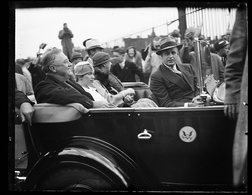 PRESIDENT AND FAMILY LEAVING UNION STATION. PRESIDENT ROOSEVELT LEAVING THE UNION STATION WITH HIS FAMILY AFTER HE WAS GREETED BY A COUPLE OF HUNDRED CONGRESSMEN, WHO CRANED THEIR NECKS AND GAPED JUST LIKE ANY OTHER GUY IN THE STREET. WITH THE PRESIDENT AARE: MRS. CURTIS DALL; MRS. ROOSEVELT; AND JA