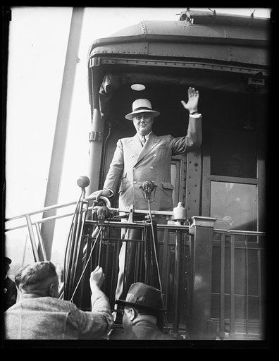 ROOSEVELT BACK FROM VACATION. RETURNING FROM HIS SUMMER WHITE HOUSE AT HYDE PARK, PRESIDENT ROOSEVELT IS CAPABLE OF SMILING DESPITE THE JUMBLED CONDITION OF HIS 'HOUSE OF LETTERS': NRA, AAA, ETC.