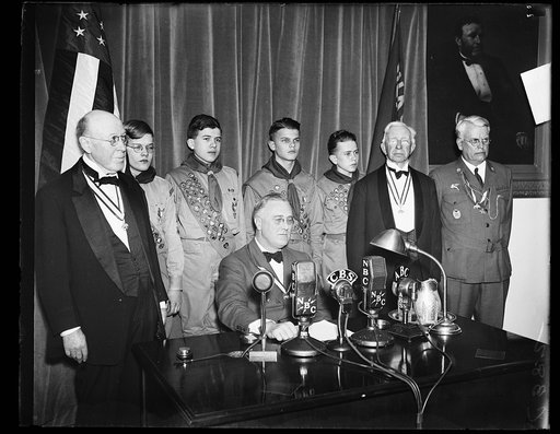PRESIDENT CONGRATULATES BOY SCOUTS. A SHORT RADIO ADDRESS WAS GIVEN BY PRESIDENT ROOSEVELT CONGRATULATING THE BOY SCOUTS ON THE 25TH ANNIVERSARY OF THEIR FOUNDING. FROM THE LEFT: BOLTON SMITH, VICE PRESIDENT OF B.S.A.; SYDNOR HODGES TROOP 97; GEORGE KEPHART, TROOP 33; LLOYD STREET TROOP 14; PHILIP C