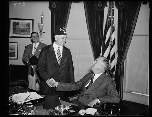 PRESIDENT ROOSEVELT GREETS LEONARD P. STEWART OF ALMAS TEMPLE