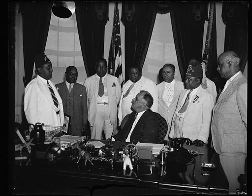 COLORED LODGE HEADS VISIT AT WHITE HOUSE. MEMBERS OF THE COLORED BRANCH OF ELKS, (I.B.P.O.E.W.) VISIT PRESIDENT ROOSEVELT AT THE WHITE HOUSE JULY 31 TO INVITE HIM TO REVIEW THE PARADE IN WASHINGTON, D.C. ON AUGUST 27, DURING THEIR NATIONAL CONVENTION HERE. DR. CHARLES B. FISHER, GEN. CONVENTION CHAI