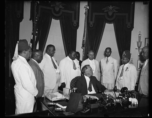 COLORED LODGE HEADS VISIT AT WHITE HOUSE. MEMBERS OF THE COLORED BRANCH OF ELKS, (I.B.P.O.E.W.) VISIT PRESIDENT ROOSEVELT AT THE WHITE HOUSE (JULY 31) TO INVITE HIM TO REVIEW THE PARADE IN WASHINGTON D.C. ON AUGUST 27, DURING THEIR NATIONAL CONVENTION HERE. DR. CHARLES B. FISHER, GENERAL CONVENTION 