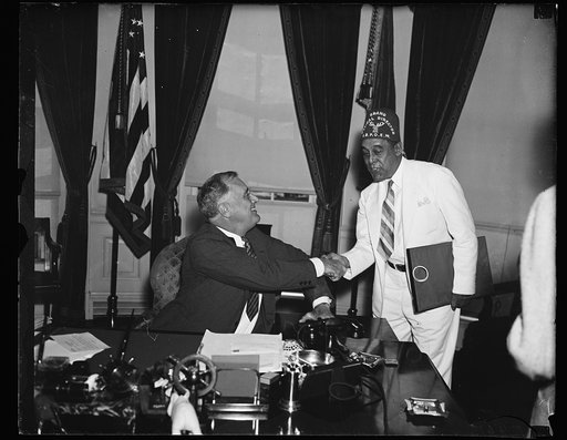 VISITS ROOSEVELT. DR. WILLIAM J. THOMPKINS, OFFICIAL OF THE COLORED I.B.P.O.E.W. VISITS PRESIDENT ROOSEVELT TO INVITE HIM TO REVIEW THE PARADE FOR THE ORDER AT THEIR CONVENTION IN WASHINGTON, D.C. AUGUST 27