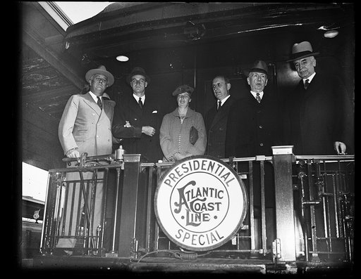 Welcome home: President Roosevelt with his son John and Mrs. Roosevelt photographed with Secretary of the Treasure Henry Morgenthau, Secretary of  Commerce Roper, and Secreatary of State Cordell Hull, who welcomed the President as he returned from his vacation which took him all over the United Stat