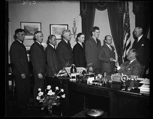 MEDALS FOR BRAVE FLIERS. PRESIDENT ROOSEVELT AWARDS AIR MAIL FLYER'S MEDALS OF HONOR TO PILOTS PERFORMING ACTS OF HEROISM. FROM THE LEFT: ROY H. WARNER, UNITED AIR LINES; GROVER TYLER, UNITED AIR LINES; LEWIS TURNER, AMERICAN AIRWAYS; WALLINGTON P. McFAIL, AMERICAN AIRWAYS; WALLINGTON P. McFAIL, AME