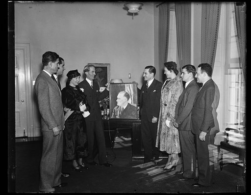 ROOSEVELT GETS ANOTHER PICTURE. MARVIN McINTYRE, PRESIDENTIAL SECRETARY, IN BEHALF OF PRESIDENT ROOSEVELT ACCEPTS THE CHARCOAL DRAWING OF THE CHIEF EXECUTIVE DONE BY JOHN WICK DANIEL, III, GRANDSON OF THE LATE SEN. JOHN DANIEL OF VIRGINIA. THIS DRAWING WAS USED AS A COVER ON THE FIRST ISSUE OF 'YOUN