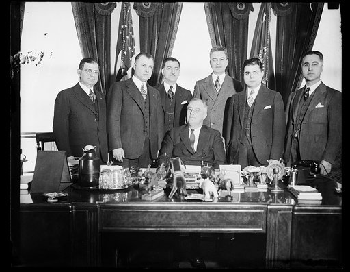 WITH GREEK SOCIETY, WASHINGTON, D.C. PRESIDENT ROOSEVELT, SEATED, POSES FOR PICTURES WITH OFFICERS OF THE ORDER OF AHEPA, AN ORGANIZATION OF GREEK-MERICANS. FROM THE LEFT: AUGUST ROGOKOS, V.I. CHEBITHES, PRESIDENT; THOMAS D. LENTGIS, D.G. MICHALOPOULOS, C.G. ECONOMOUS, AND GEORGE K. DEMOPULOS