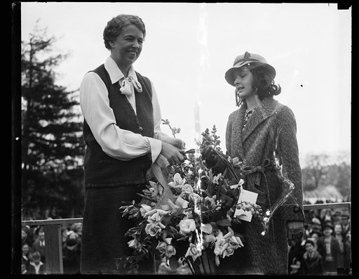 FLOWERS FOR FIRST LADY. WASHINGTON, D.C. APRIL 13. DORIS THORNE, ACTING FOR THE GOOD SAMARITANS, A CHARITABLE ORGANIZATION, PRESENTS A BASKET OF FLOWERS TO MRS. FRANKLIN ROOSEVELT. THIS WAS PART OF THE COLORFUL EASTER EGG ROLLING CEREMONIES ON THE WHITE HOUSE LAWN