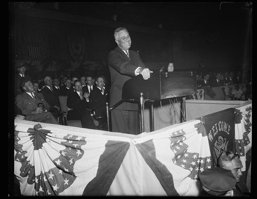 PRESIDENT SMILES. BALTIMORE, MD, APRIL 13. PRESIDENT ROOSEVELT WORE HIS IRREPRESABLE SMILE AS HE BEGAN HIS ADDRESS TO THE YOUNG DEMOCRATS HERE TONIGHT. IT WAS THE OPENING ORATION IN THE 1936 CAMPAIGN