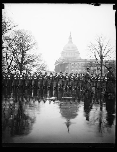 WEST POINT CADETS, WASHINGTON, D.C. JANUARY 20. DESPITE THE HEAVY DOWNPOUR, THE WEST POINT CADETS PRESENTED A SNAPPY APPEARANCE AS THEY MARCHED IN THE INAUGURAL PARADE TODAY