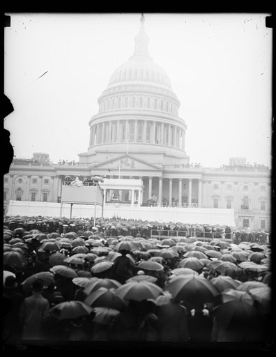 SEA OF UMBRELLAS, WASHINGTON, D.C. JANUARY 20. PRESIDENT ROOSEVELT FACED A VERITABLE SEA OF UMBRELLAS AS HE TOOK HIS SECOND OATH OF OFFICE AND DELIVERED HIS INAUGURAL ADDRESS AT THE CAPITOL TODAY. THOUSANDS BRAVED THE CHILL RAIN TO WITNESS THE CEREMONY