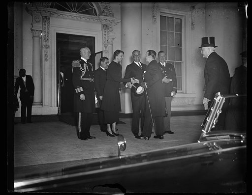 PRESIDENT AND MRS. ROOSEVELT GREET GOVERNOR GENERAL OF CANADA AT WHITE HOUSE. WASHINGTON, D.C., MARCH 30. PRESIDENT AND MRS. ROOSEVELT EXTENDING A WARM GREETING TO THE GOVERNOR GENERAL OF CANADA LORD TWEEDSMUIR AS HE ARRIVED AT THE WHITE HOUSE TODAY FOR A FEW DAYS. LORD AND LADY TWEEDSMUIR ARE IN WA