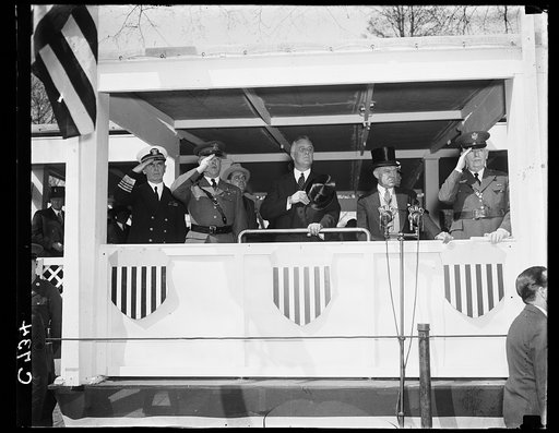 PRESIDENT REVIEWS ARMY DAY PARADE. WASHINGTON, D.C. APRIL 6. PRESIDENT ROOSEVELT WITH SECRETARY OF WAR HARRY H. WOODRING (RIGHT) AND GENERAL MALIN H. CRAIG, U.S. CHIEF OF STAFF; REVIEWING THE ARMY DAY PARADE IN THE CAPITAL IN OBSERVANCE OF THE TWENTIETH TWENTIETH ANNIVERSARY OF AMERICA'S ENTRANCE IN