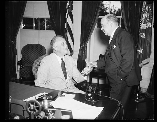 PRESIDENT BECOMES HEAD OF AMERICAN CROSS OF HONOR SOCIETY. WASHINGTON, D.C. JUNE 23. PRESIDENT ROOSEVELT TODAY BECAME HONORARY HEAD OF THE AMERICAN CROSS OF HONOR SOCIETY AND IS SHOWN RECEIVING AN HONORARY LIFE-SAVING MEDAL OF THE ORGANIZATION FROM RICHARD STOCKTON, NEWARK, NJ, SOCIETY PRESIDENT