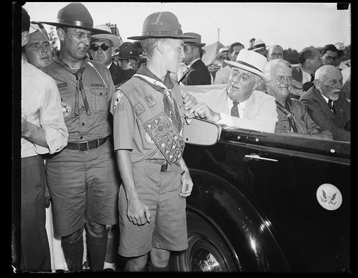 President decorates Duchess County scout. July 7. After leaving the all-state game today President Roosevelt motored to the National Jamboree of the Boy Scouts where he visited the camp of the Duchess County, NY. scouts. He is shown pinning the award of Eagle Scout on Frankly. St. John, Troop #7, of