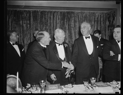 PRESIDENT ROOSEVELT PRESENTS MEDAL TO EXPLORER LINCOLN ELLSWORTH. WASHINGTON, D.C. PRESIDENT ROOSEVELT PRESENTING TO LINCOLN ELLSWORTH, AMERICAN EXPLORER, A GOLD CONGRESSIONAL MEDAL AWARDED IN RECOGNITION OF HIS ANTARCTIC FLIGHT OF 1935 DURING WHICH HE CLAIMED 350,000 SQUARE MILES IN ANTARCTICA FOR 