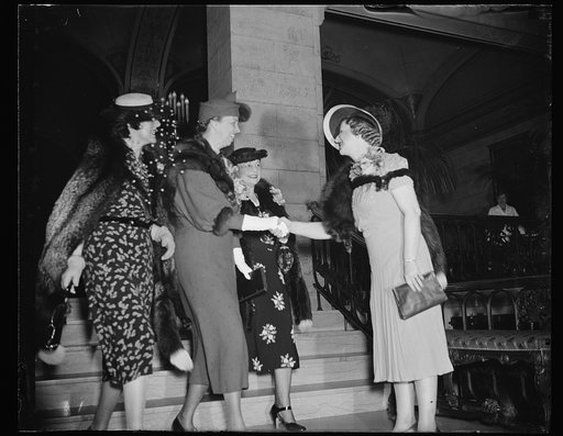 FIRST LADY GUEST OF 73 CLUB. WASHINGTON, D.C. APRIL 5. MRS. FRANKLIN ROOSEVELT IS GREETED BY MRS. RICHARD M. DUNCAN, WIFE OF THE CONGRESSMAN FROM MISSOURI, AS SHE ARRIVES AT THE SHOREHAM HOTEL TODAY TO BE A GUEST OF THE 73 CLUB AT A LUNCHEON. WIVES OF SENATORS AND REPRESENTATIVES WHO ENTERED CONGRES