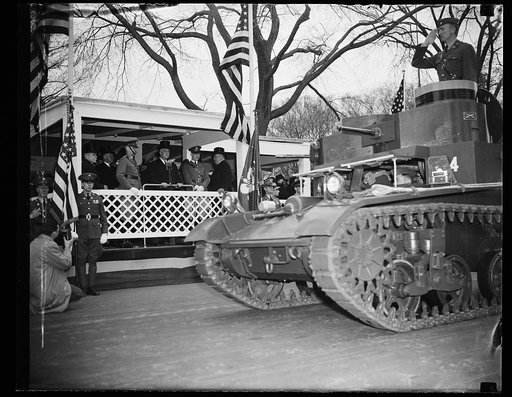 PRESIDENT ROOSEVELT REVIEWS ARMY DAY PARADE. WASHINGTON, D.C. APRIL 6. PRESIDENT ROOSEVELT LED THE NATION TODAY IN OBSERVING ARMY DAY AS HE REVIEWED A COLORFUL PARADE COMPRISED OF VIRTUALLY EVERY ARM OF THE SERVICE. RUMBLING OF THE GIANT TANKS REVIVED MEMORIES OF AMERICA'S ENTRY INTO THE WORLD WAR T