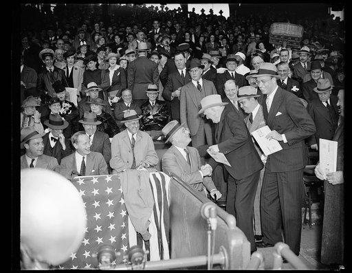 FORGET NATION'S BUSINESS FOR NATIONAL PASTIME. WASHINGTON, D.C. APRIL 18. CONGRESSIONAL BICKERING, THE REORGANIZATION BILL, AND THOUGHTS OF ANOTHER DEPRESSION WERE FAR FROM THE MINDS OF PRESIDENT ROOSEVELT AND VICE PRESIDENT GARNER TODAY AS THEY MET AT THE 1938 BASEBALL SEASON'S OPENER BETWEEN THE S