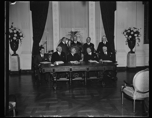 U.S.-GREAT BRITAIN-CANADA TRADE TREATY SIGNED AT WHITE HOUSE, WASHINGTON, D.C. NOVEMBER 17. THE HISTORIC EAST ROOM OF THE WHITE HOUSE WAS THE SCENE TODAY AS THE GREATEST TRADE TREATY IN RECENT HISTORY, EMBRACING A TOTAL AMERICAN TRADE OF 1,500,000,000 DOLLARS, WAS SIGNED BY PRESIDENT ROOSEVELT, BRIT