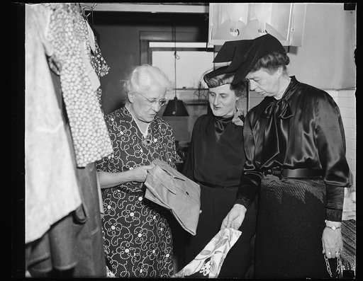 First lady and Mrs. Morgenthau see umemployed trade time for clothes and food, Washington, D.C. February 9. Mrs. Franklin D. Roosevelt and Mrs. Henry Morgenthau today visited the self-help exchange here to see employable unemployed helping each other. Members produce goods which are exchanged to oth