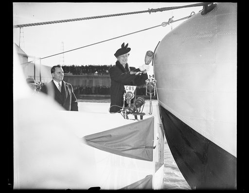 FIRST LADY CHRISTENS YANKEE CLIPPER. WASHINGTON, D.C. MARCH 3. MRS. ROOSEVELT TODAY SMASHED A BOTTLE OF WATER FROM THE SEVEN SEAS ON THE BOW OF THE YANKEE CLIPPER, CHRISTENING THE 40-TON, 74 PASSENGER FLYING BOAT WHICH WILL INAUGURATE TRANSATLANTIC AIR PASSENGER SERVICE. THE CEREMONY TOOK PLACE AT T