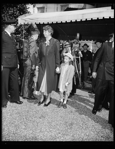 DAUGHTER OF COMMERCE SECRETARY FILLS IN FOR ROOSEVELT GRANDCHILDREN AT EGG ROLLING. WASHINGTON, D.C. APRIL 10. DURING THE ABSENCE OF THE ROOSEVELT GRANDCHILDREN FROM THE TRADITIONAL EASTER EGG ROLLING AT THE WHITE HOUSE TODAY, LITTLE DIANA HOPKINS, DAUGHTER OF THE SECRETARY OF COMMERCE, HELPED MRS. 