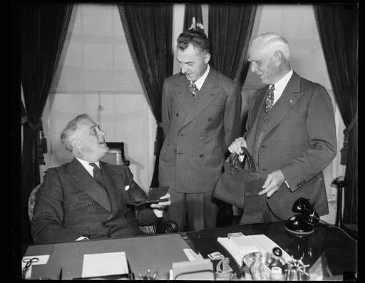 PRESIDENT GETS BASEBALL 'ANNIE OAKLEYS.' WASHINGTON, D.C. APRIL 13. PRESIDENT AND MRS. ROOSEVELT ARE NOW ALL SET FOR THE MAJOR LEAGUE BASEBALL GAMES THIS SUMMER. TODAY AT THE WHITE HOUSE CLARK GRIFFITH, PRESIDENT OF THE WASHINGTON SENATORS, AND FORD FRICK, PRESIDENT OF THE NATIONAL LEAGUE, PRESENTED