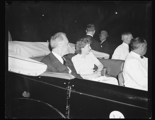 THE PRESIDENT AND WIFE OF AIDE ENJOY OPEN AIR CONCERT ON POTOMAC. WASHINGTON, D.C. JULY 12. THE PRESIDENT AND MRS. EDWIN M. WATSON, WIFE OF THE PRESIDENT'S AIDE, SITTING IN THE PRESIDENTIAL CAR LISTENING TO THE WASHINGTON SYMPHONY ORCHESTRA UNDER THE DIRECTION OF DR. HANS KINDLER AS THE ORCHESTRA PL