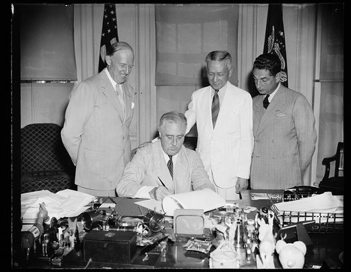 PRESIDENT SIGNS PHILIPPINE BILL. WASHINGTON, D.C. AUGUST 7. PRESIDENT ROOSEVELT TODAY SIGNED A MEASURE DESIGNED TO FACILITATE THE ECONOMIC ADJUSTMENT OF THE PHILIPPINE COMMONWEALTH TO INDEPENDENCE STATUS. IT PROVIDES FOR GRADUALLY DECLINING DUTY-FREE QUOTAS ON IMPORTS FROM THE PHILIPPINES OF COCONUT