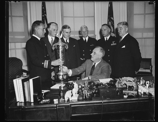 PRESIDENT ROOSEVELT AWARDS THE SCHIFF TROPHY. WASHINGTON, D.C. NOVEMBER 14. PRESIDENT ROOSEVELT PRESENTED THE SCHIFF TROPHY FOR MAXIMUM SAFETY IN NAVAL AVIATION OPERATIONS TO THE SEVENTH PATROL SQUADRON WHICH OPERATED 4,903 HOURS IN THE AIR FROM ITS SAN DIEGO BASE LAST YEAR WITHOUT AN ACCIDENT. DURI