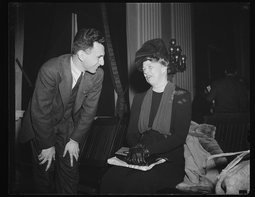 FIRST LADY CHATS WITH DIES WITNESS. WASHINGTON, D.C. DECEMBER 1. MRS. ROOSEVELT, WHO ATTENDED THE DIES HEARING TODAY FOR THE THIRD TIME IN TWO DAYS, PICTURED AS SHE CHATTED WITH JOSEPH P. LASH, EXECUTIVE SECRETARY OF THE AMERICAN STUDENTS' UNION, TODAY'S WITNESS BEFORE THE COMMITTEE
