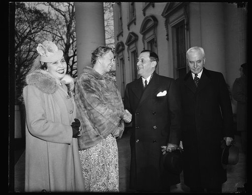 FIRST LADY WELCOMES PRESIDENT-ELECT OF COSTA RICA TO WHITE HOUSE. WASHINGTON, D.C. MARCH 25. MRS. ROOSEVELT GREETING PRESIDENT-ELECT OF COSTA RICA DR. RAFAEL A. CALDERON GUARDIA AND SENORA DE CALDERSON GUARDIA WHEN THEY ARRIVED FOR A VISIT AT THE WHITE HOUSE TODAY. SECRETARY OF STATE CORDELL HULL IS