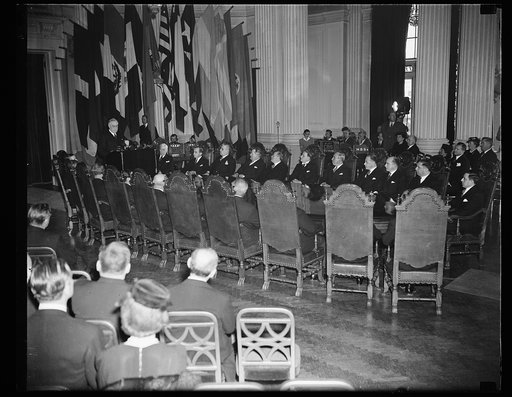 PRESIDENT ROOSEVELT ADDRESSES PAN AMERICAN BOARD ON 50TH ANNIVERSARY. WASHINGTON, D.C. APRIL 15. PRESIDENT ROOSEVELT, SHOWN HERE STANDING TO RECEIVE AN OVATION FROM MINISTERS AND AMBASSADORS FROM THE 21 PAN AMERICAN REPUBLICS, ADDRESSED THE GOVERNING BOARD OF THE UNION ON ITS 50TH ANNIVERSARY. HE SA