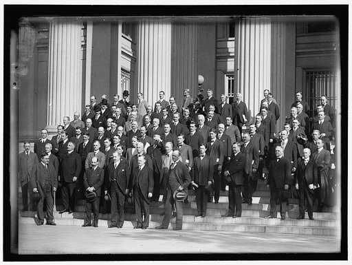 FEDERAL RESERVE BOARD WITH BANKERS. FRONT: WARBURG; WILLIAMS; HAMLIN; DELANO. IN REAR IS LARGE GROUP OF GOVERNORS AND BANKERS