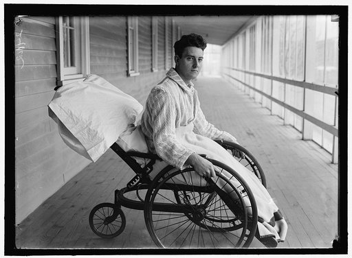 Young veteran soldier in wheelchair on porch, Walter Reed Hospital, Washington, D.C.
