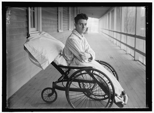 Young veteran soldier in wheelchair on porch, Walter Reed Hospital, Washington, D.C.