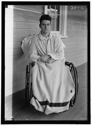 Young veteran soldier in wheelchair on porch, Walter Reed Hospital, Washington, D.C.