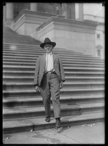 Boy on steps of U.S. Capitol, Washington, D.C.