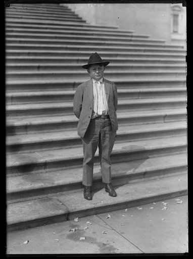 Boy on steps of U.S. Capitol, Washington, D.C.
