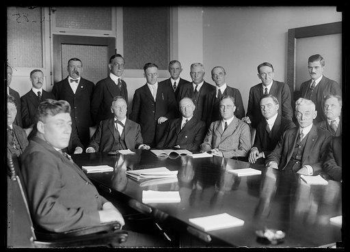 Group includes Josephus Daniels at head of table; and Franklin D. Roosevelt