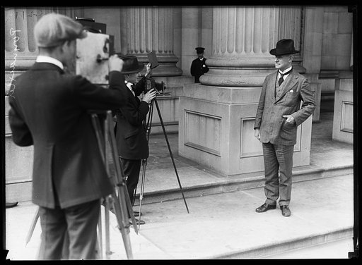 Poindexter [i.e., Miles Poindexter, with photographers. U.S. Capitol, Washington, D.C.
