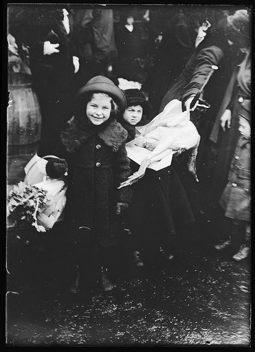 Child with baskets with provisions