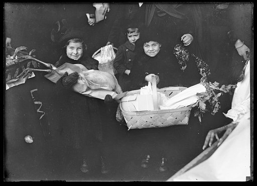 Child with baskets with provisions