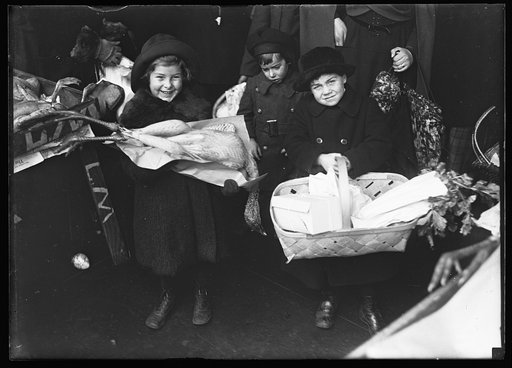 Child with baskets with provisions
