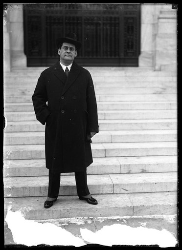 Man in front of Pan American Union Building, Washington, D.C.