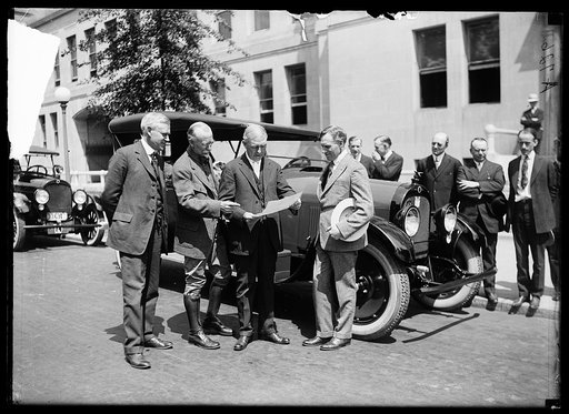 Group at automobile; Charles Sawyer, 2nd from left