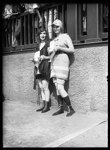 Female swimmers with award cups