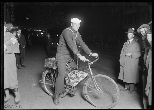 Tony Pizzo, with sailor hat on bicycle "New York to Los Angeles and Return"